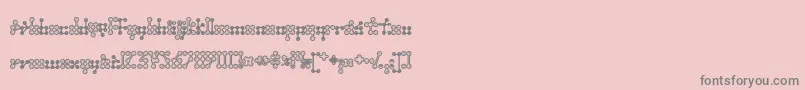 Wednesda-fontti – harmaat kirjasimet vaaleanpunaisella taustalla