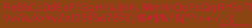 フォントBaron – 赤い文字が茶色の背景にあります。