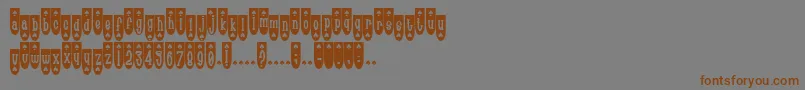 Popsp-Schriftart – Braune Schriften auf grauem Hintergrund
