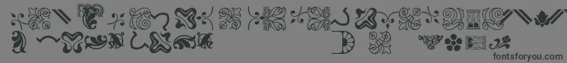 Bordersornament3-Schriftart – Schwarze Schriften auf grauem Hintergrund