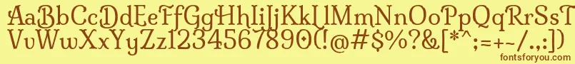 フォントMilongaRegular – 茶色の文字が黄色の背景にあります。