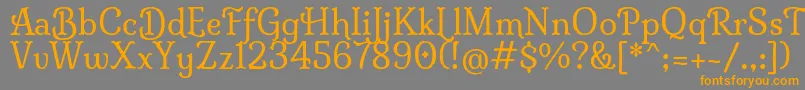 フォントMilongaRegular – オレンジの文字は灰色の背景にあります。