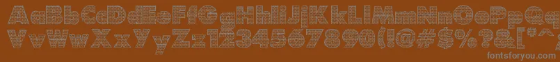 Brick-Schriftart – Graue Schriften auf braunem Hintergrund