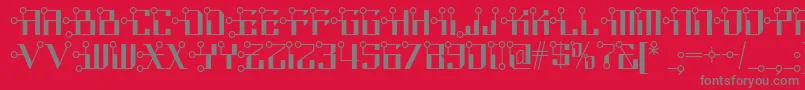 フォントCircuitborednf – 赤い背景に灰色の文字