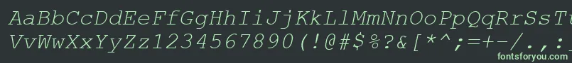 Axccrti Font – Green Fonts on Black Background
