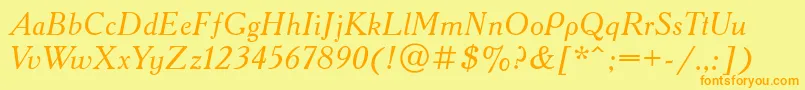 フォントAcademycttItalic – オレンジの文字が黄色の背景にあります。