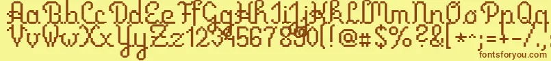 フォントPrimus – 茶色の文字が黄色の背景にあります。