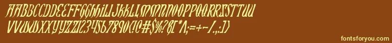 XiphosCondensedItalic-fontti – keltaiset fontit ruskealla taustalla