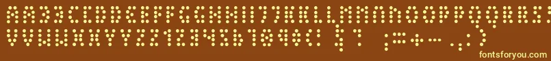 PeexExtralight-fontti – keltaiset fontit ruskealla taustalla