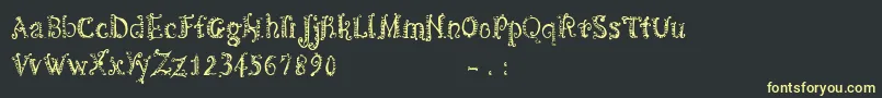フォントCfspiralityRegular – 黒い背景に黄色の文字