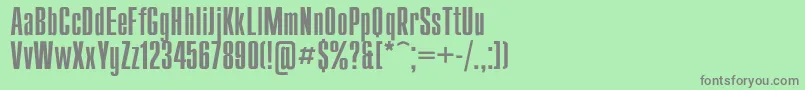 フォントCompactRegular – 緑の背景に灰色の文字