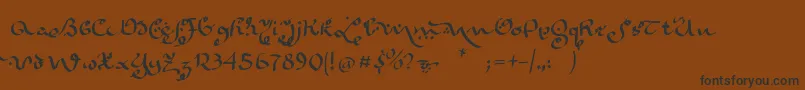 フォントKarabennemsi – 黒い文字が茶色の背景にあります