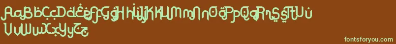 フォントRodjaBoldAltEnd – 緑色の文字が茶色の背景にあります。