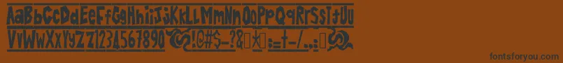 BatikAlin Font – Black Fonts on Brown Background