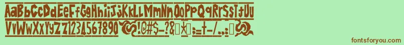 BatikAlin Font – Brown Fonts on Green Background