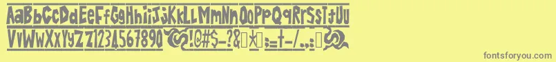 フォントBatikAlin – 黄色の背景に灰色の文字