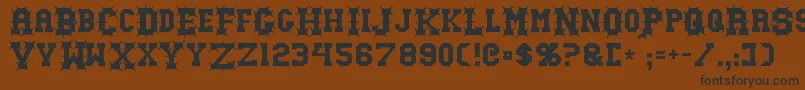 Gutcruncher Font – Black Fonts on Brown Background