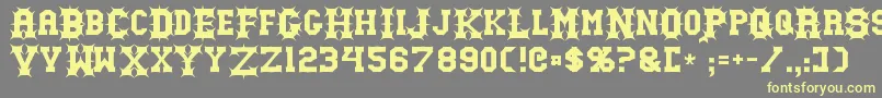 Gutcruncher Font – Yellow Fonts on Gray Background