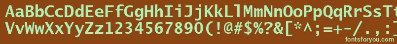 フォントLucidasanstypewriterstdBd – 緑色の文字が茶色の背景にあります。