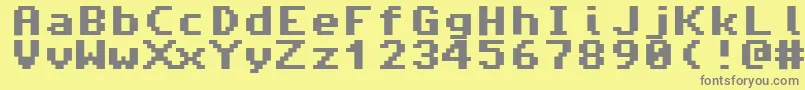 Fonte Amiga4ever – fontes cinzas em um fundo amarelo