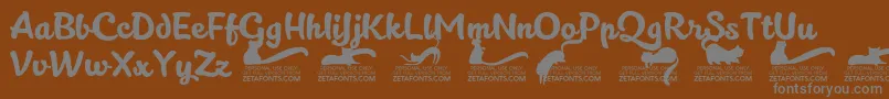 Kittenslanttrial-fontti – harmaat kirjasimet ruskealla taustalla