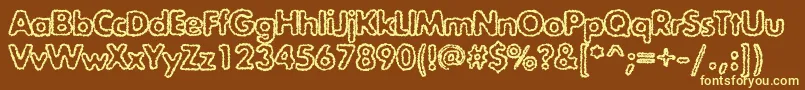 Exposureroughoutlinec-fontti – keltaiset fontit ruskealla taustalla