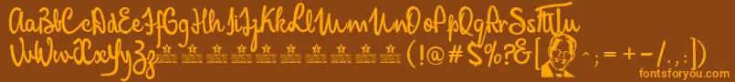 MandelaScriptPersonalUse-fontti – oranssit fontit ruskealla taustalla