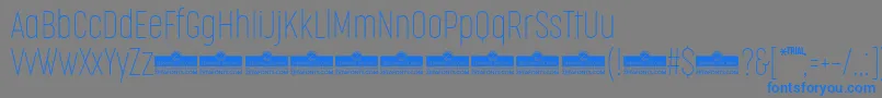 Шрифт CocogooseCompressedThinTrial – синие шрифты на сером фоне