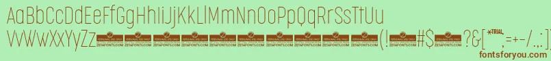 CocogooseCompressedThinTrial Font – Brown Fonts on Green Background