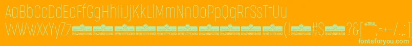Fonte CocogooseCompressedThinTrial – fontes verdes em um fundo laranja