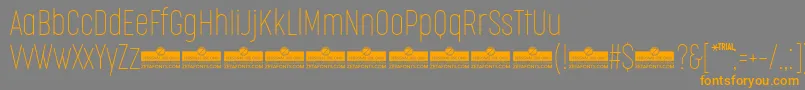 Шрифт CocogooseCompressedThinTrial – оранжевые шрифты на сером фоне