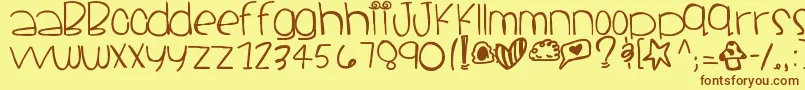 フォントSantacruz – 茶色の文字が黄色の背景にあります。