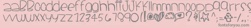 Santacruz-fontti – harmaat kirjasimet vaaleanpunaisella taustalla
