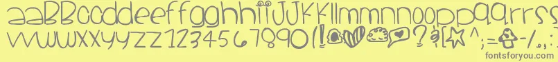 Santacruz-fontti – harmaat kirjasimet keltaisella taustalla