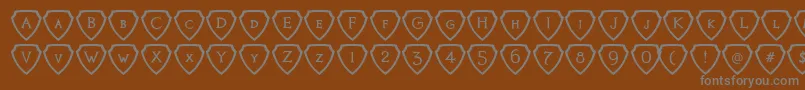 fuente KnightsQuestShielded – Fuentes Grises Sobre Fondo Marrón