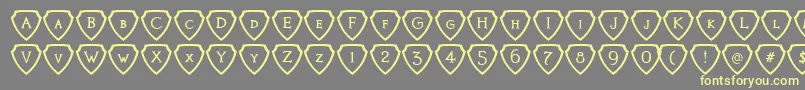 フォントKnightsQuestShielded – 黄色のフォント、灰色の背景