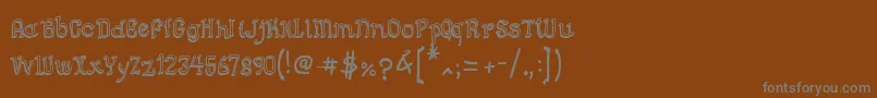 フォントSemiCursiveGut – 茶色の背景に灰色の文字