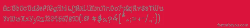 フォントSemiCursiveGut – 赤い背景に灰色の文字