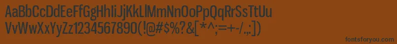 フォントGnuolaneRg – 黒い文字が茶色の背景にあります