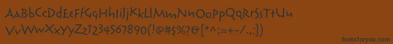 フォントReliqstdExtraactive – 黒い文字が茶色の背景にあります