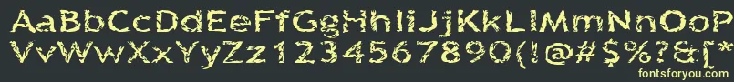 フォントQuinquef – 黒い背景に黄色の文字