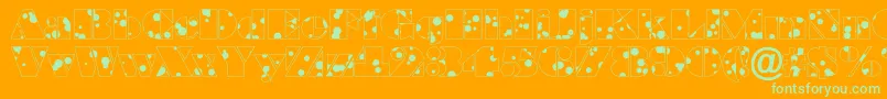 Fonte BraggadrRegular – fontes verdes em um fundo laranja