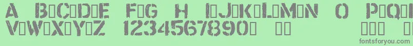 Fonte CftrashzoneRegular – fontes cinzas em um fundo verde