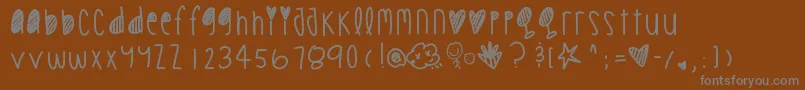 Cookiechips-Schriftart – Graue Schriften auf braunem Hintergrund