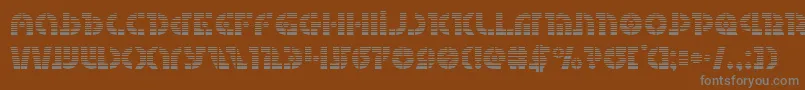 Questlokgrad-fontti – harmaat kirjasimet ruskealla taustalla