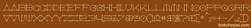 Anglocelestial-fontti – keltaiset fontit ruskealla taustalla