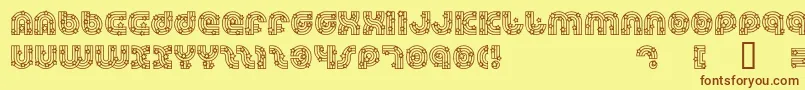 フォントDreamlandStars – 茶色の文字が黄色の背景にあります。