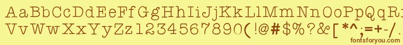 フォントKbyourejustmytypethin – 茶色の文字が黄色の背景にあります。