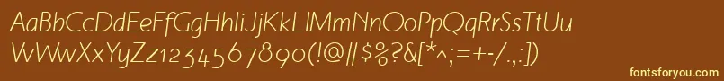 MalvernOsfItalic-fontti – keltaiset fontit ruskealla taustalla