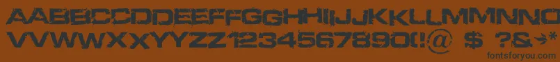 フォントDefused – 黒い文字が茶色の背景にあります